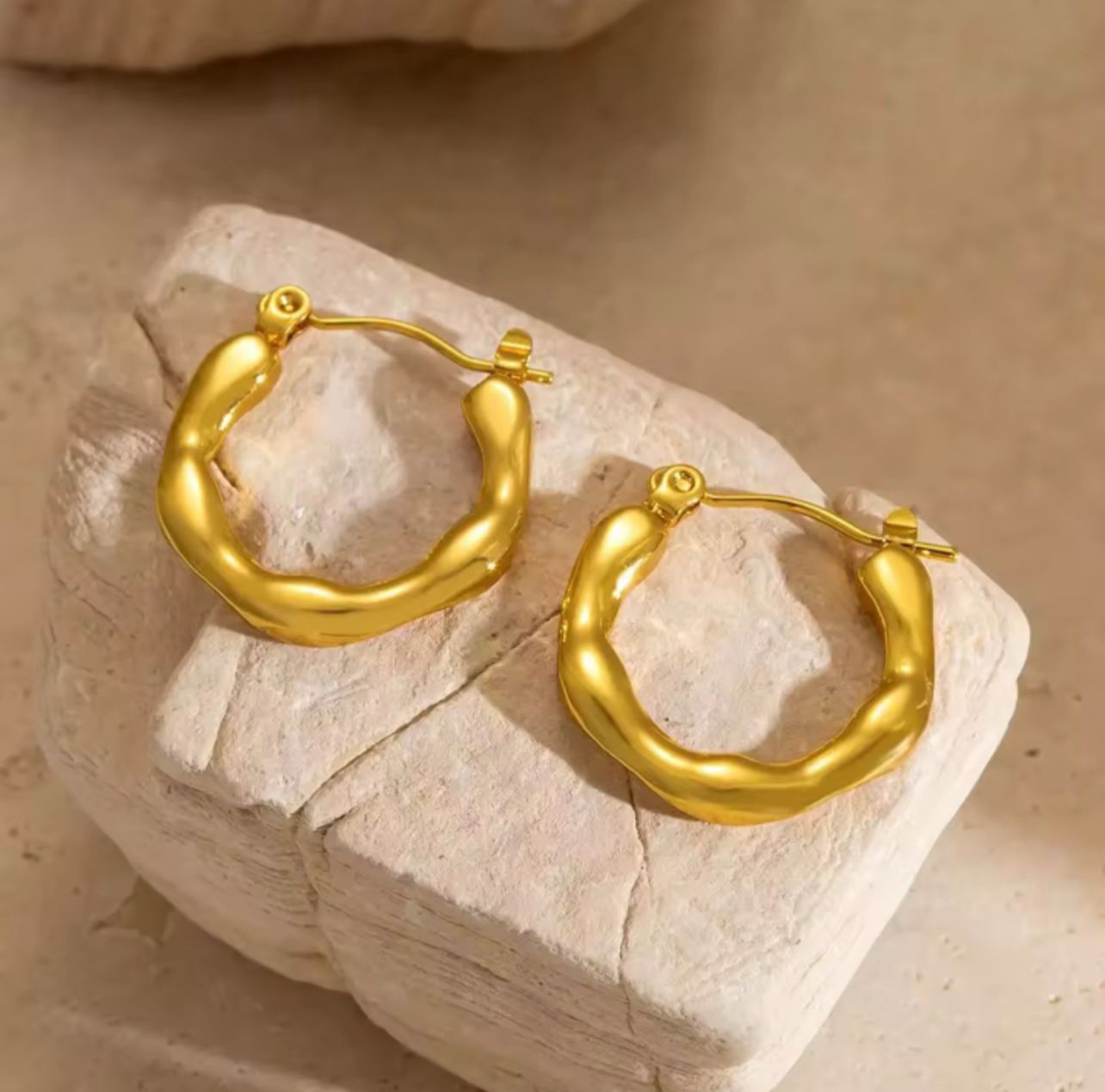 Pair of 18K gold plated molten-texture hoop earrings with an organic shape – waterproof, hypoallergenic, and anti-tarnish.