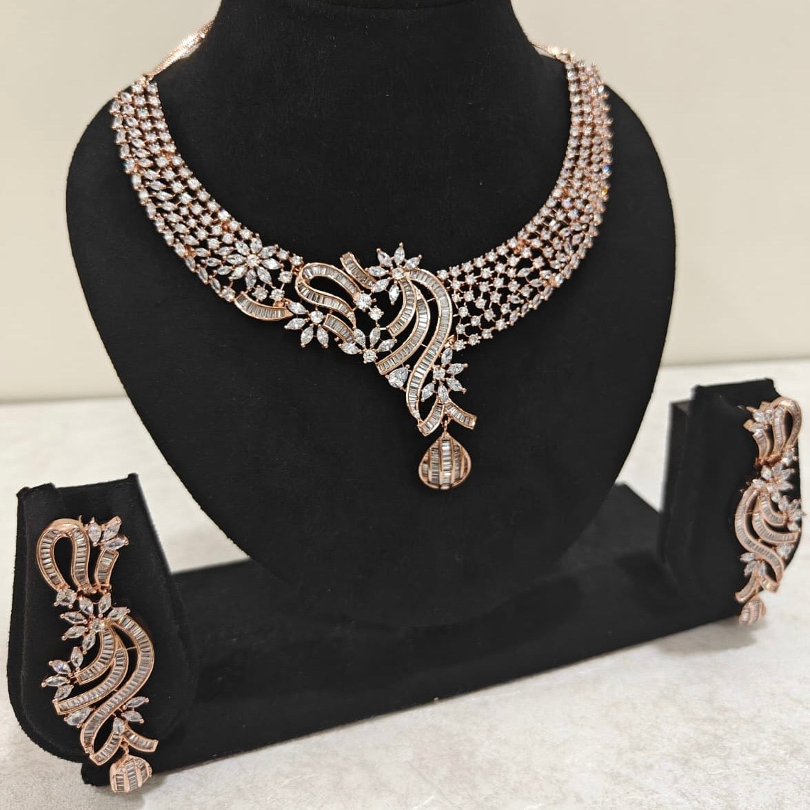 Elegant rose gold American Diamond necklace set with floral design and matching earrings