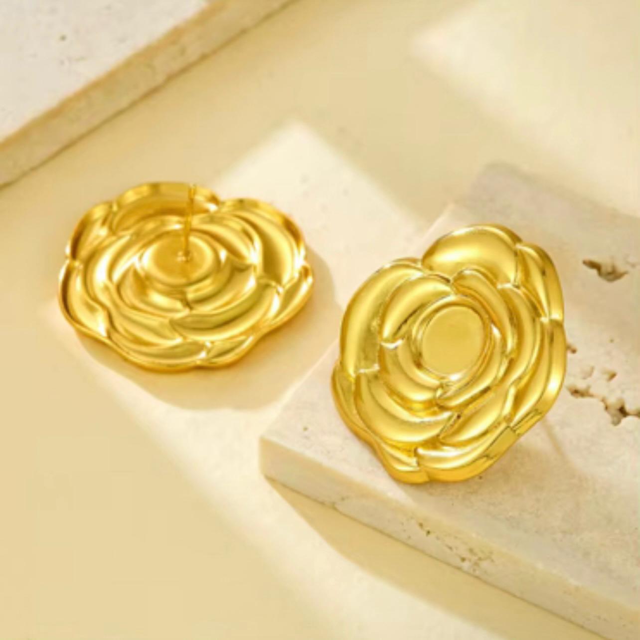 Close-up of 18K gold plated floral stud earring on ear – sculpted petal design, waterproof, hypoallergenic, and anti-tarnish.