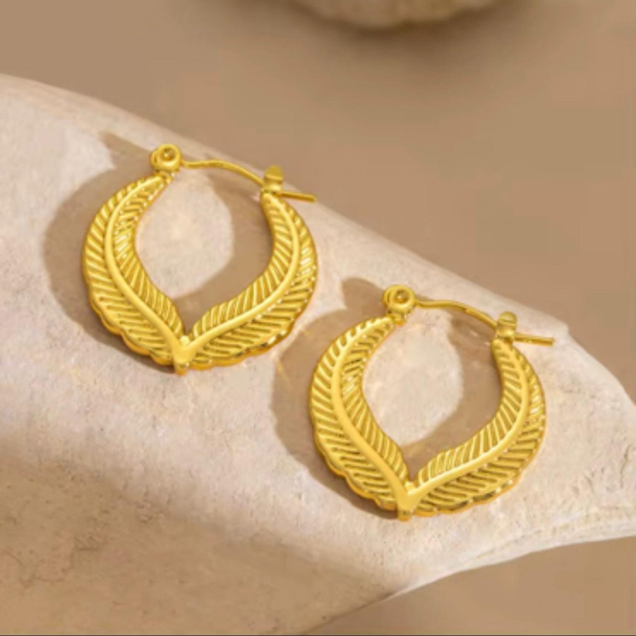 Pair of 18K gold plated leaf hoop earrings with a textured botanical design – waterproof, hypoallergenic, and anti-tarnish.