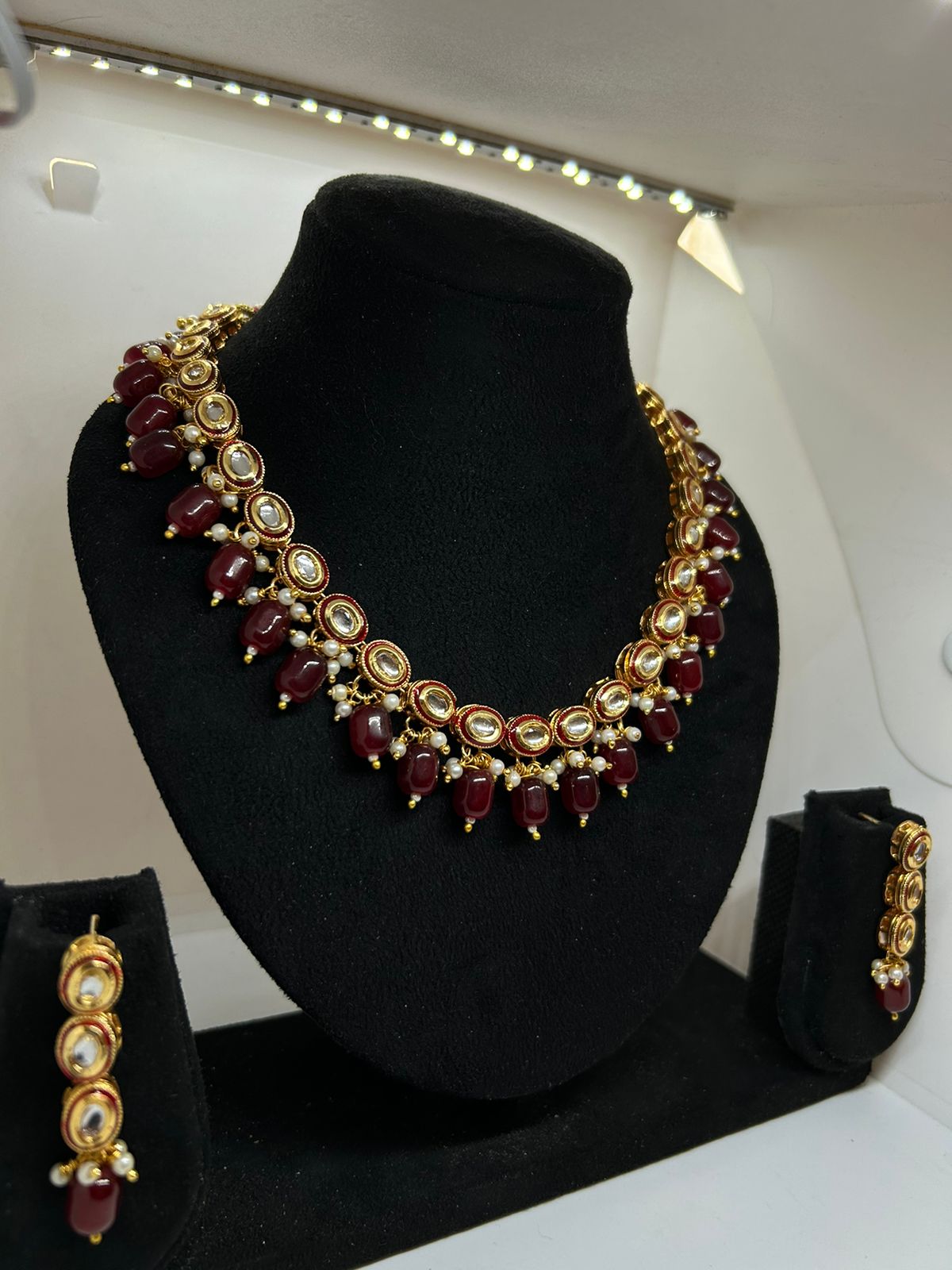The Majestic Maroon Kundan Necklace with Hangings and Earrings