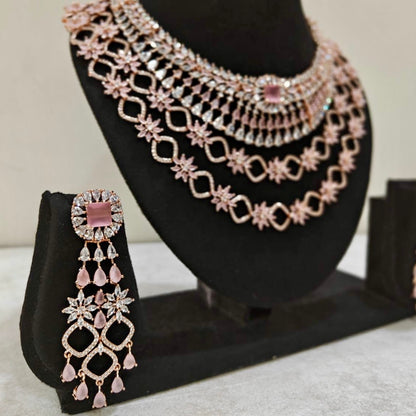 Detailed close-up of blush pink American Diamond statement earrings