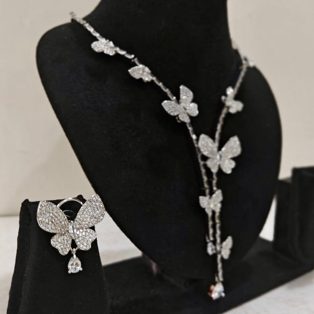 Side angle of butterfly necklace set with sparkling stones