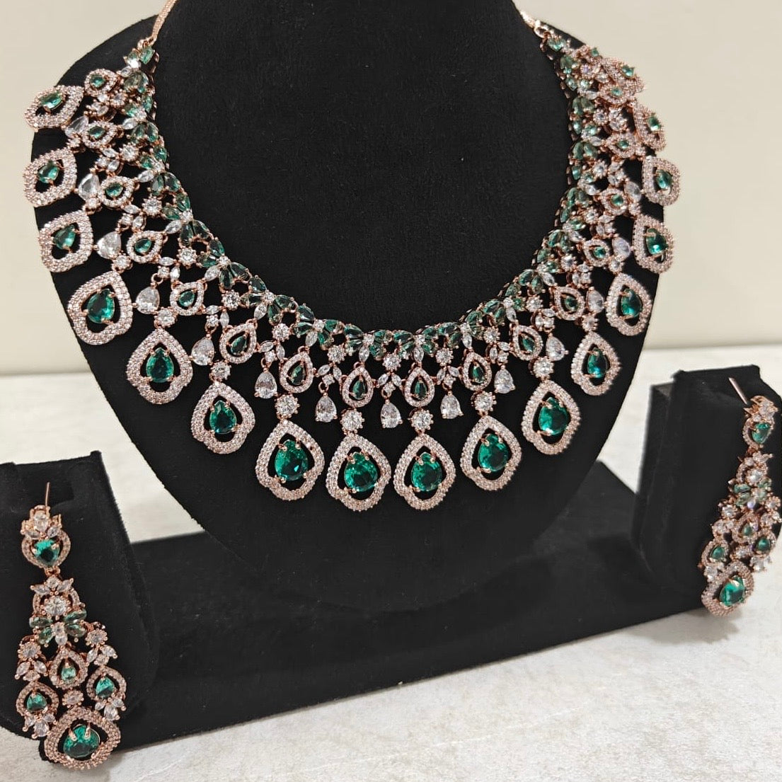 Statement emerald green drop earrings with rose gold American Diamond necklace – bridal and party jewellery