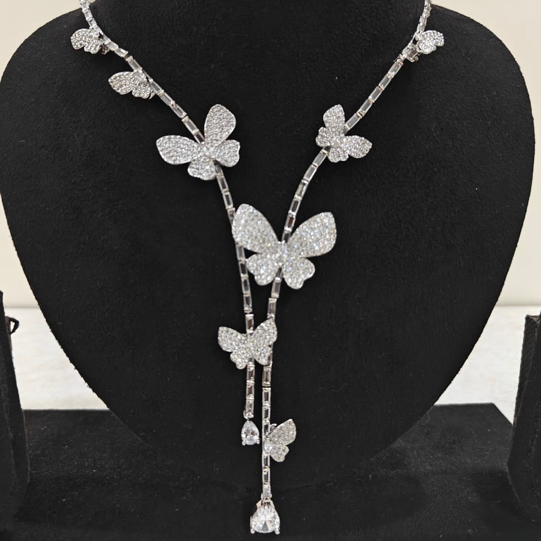Close-up of butterfly design American Diamond necklace