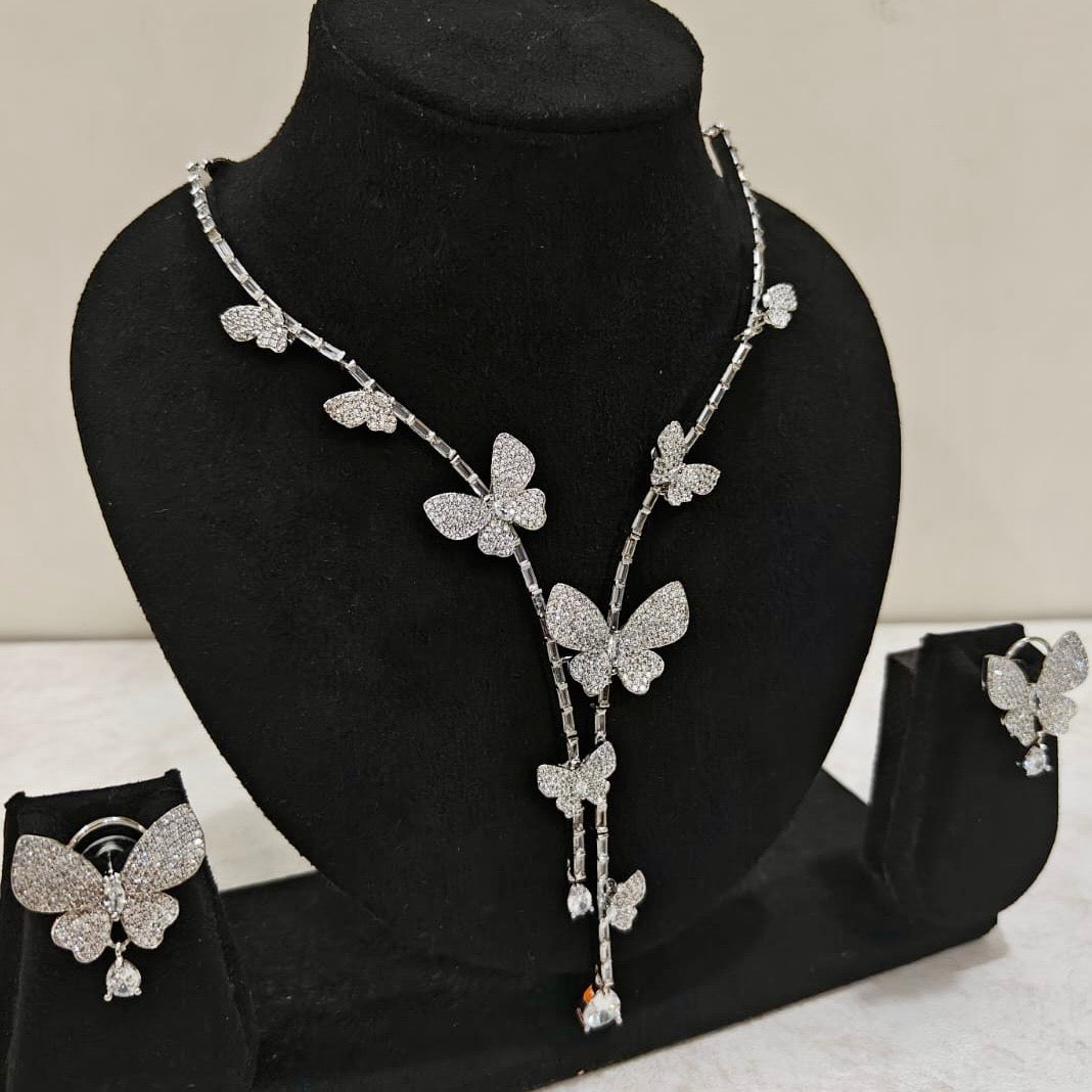 Front view of butterfly motif necklace set in silver finish