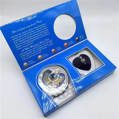 Open Love Pearl Wish Necklace box showing oyster and silver cage necklace