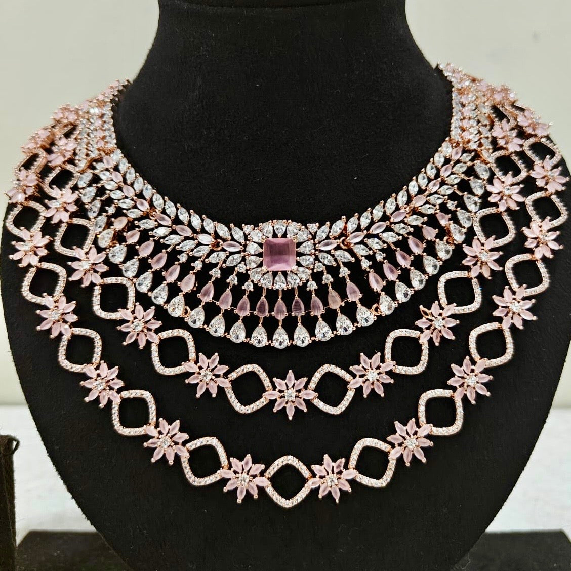 Close-up view of blush pink American Diamond bridal necklace with CZ stones