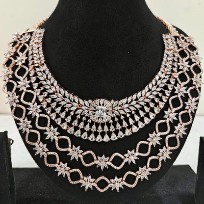 Close-up of rose gold American Diamond necklace with layered starburst design