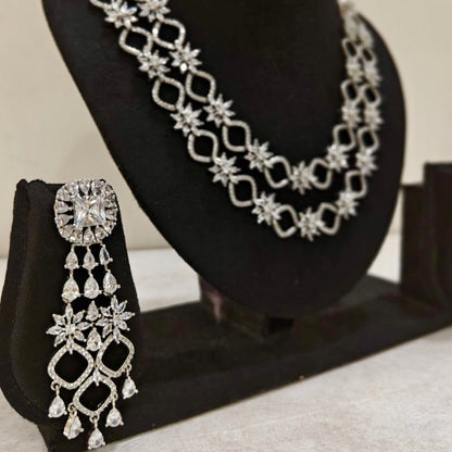 Statement American Diamond long earrings paired with double-layered starburst necklace
