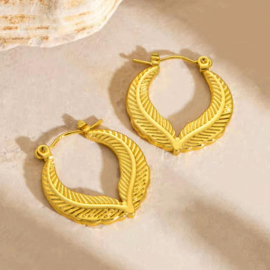 Pair of 18K gold plated leaf hoop earrings with a textured botanical design – waterproof, hypoallergenic, and anti-tarnish.