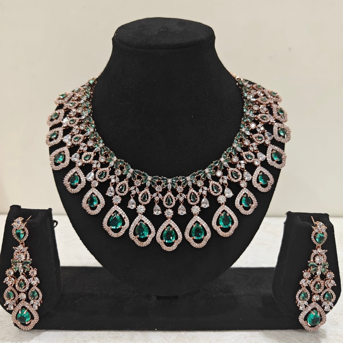 Rose gold American Diamond necklace set with emerald green teardrop stones and matching earrings – ThePandaStoree