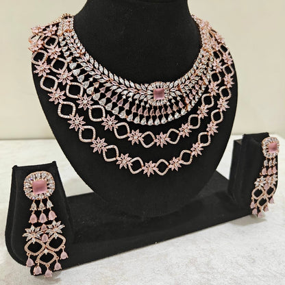 Side view of blush pink layered American Diamond necklace and matching earrings