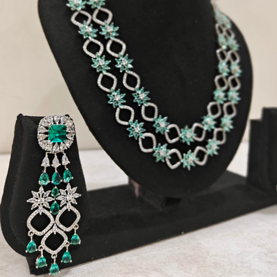 Statement emerald green earrings with American Diamond double-layered necklace – perfect for weddings